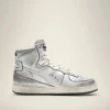 GEBRUIKTE METALEN SNEAKER